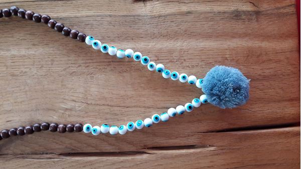 Picture of wooden necklace with pompon